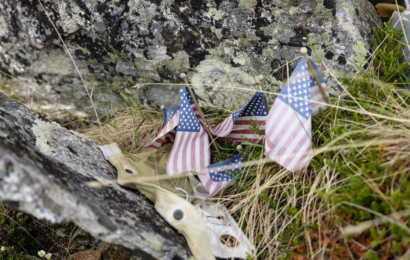 Flags and wreckage at the B-24 crash site